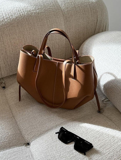 Patricia | Designet handleveske med sidefrynser